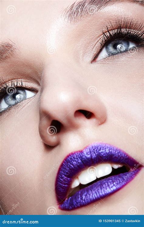 Closeup Macro Shot Of Human Woman Face Makeup And Bright Violet Lips