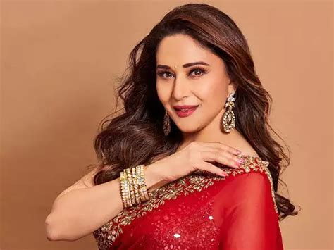 Madhuri Dixit Nene Exudes Elegance In A Timeless Red Saree