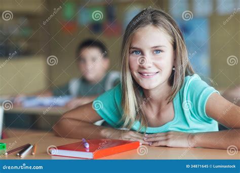 Smiling Schoolgirl Sitting In The Classroom Stock Image Image Of Smile Classroom 34871645