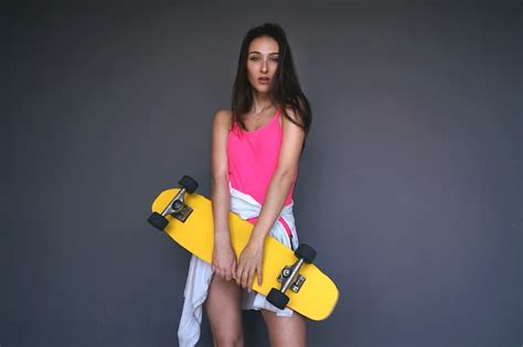 Premium Photo Sporty Girl In Pink Bikini Swimwear Holds Her Yellow