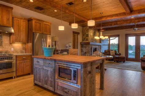 Paired with reclaimed wood or stone, these sorts of finishes will give your rustic kitchen a modern sensibility. Rustic Contemporary - Rustic - Kitchen - Austin - by Legacy DCS