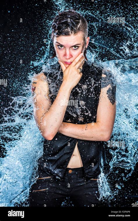 Boyish Woman Looking Fierce In Water Splashes Stock Photo Alamy