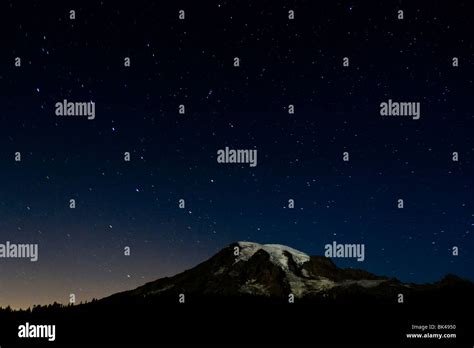 Night Shot Of Mount Rainier With Stars In The Night Sky Stock Photo Alamy