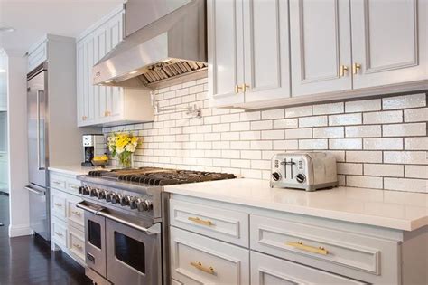 Chrome or stainless steel can also create a sleek, polished look, and particularly dark shades of grey, almost black, can look elegant with gold hardware. Light Gray Kitchen Cabinets with Gold Hardware ...