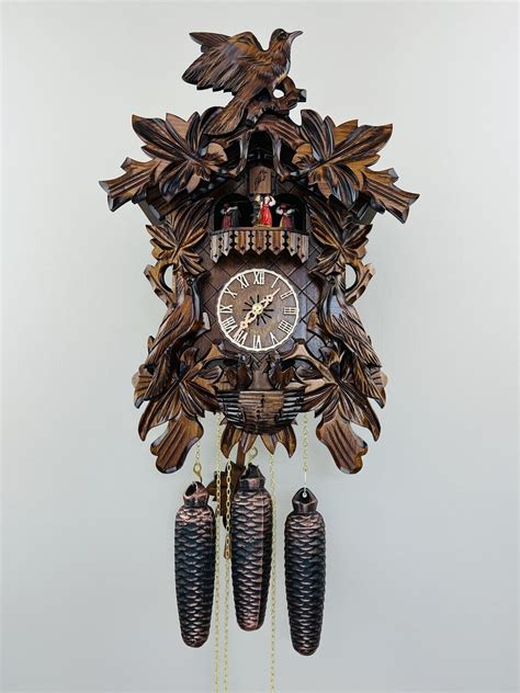 17 Eight Day Musical Cuckoo Clock With Hand Carved Birds Leaves And
