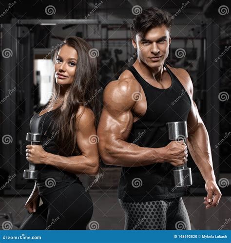 Sporty Sexy Couple Showing Muscle And Workout In Gym Muscular Man And Wowan Royalty Free Stock