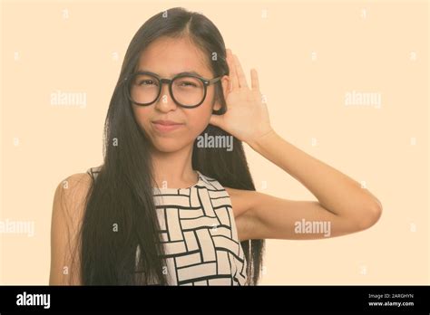 Young Asian Teenage Nerd Girl With Eyeglasses Listening Stock Photo Alamy