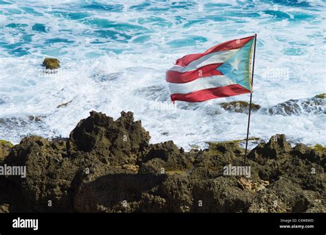 Puerto Rico Old San Juan Puerto Rican Flag On Rock With Sea In