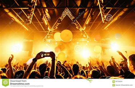 Night Club Silhouette Crowd Hands Up With Fly Entertanment Stock Photo