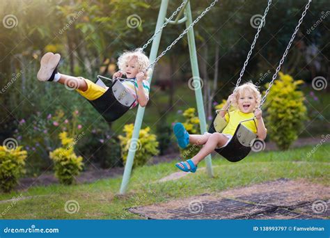 Child Swinging On Playground Kids Swing Stock Image Image Of Cute