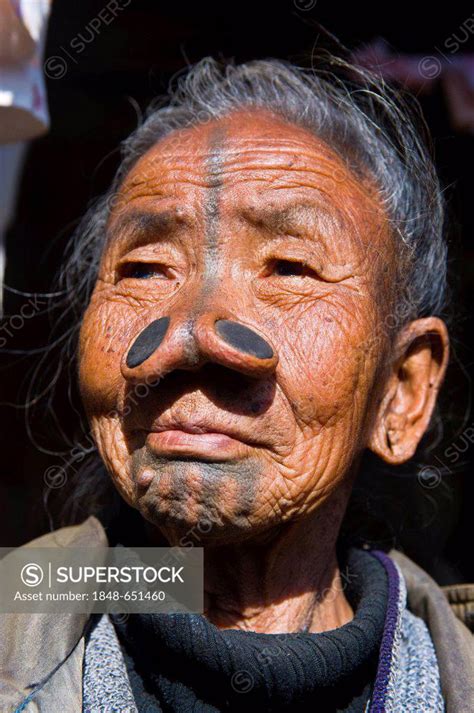 Old Woman From The Apatani Tribe Known For The Pieces Of Wood In Their Nose To Make Them Ugly