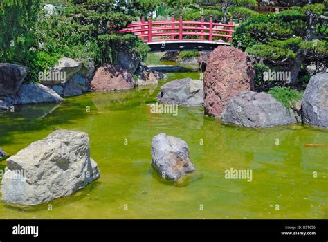 Japanese Red Bridge In Zen Garden Stock Photo Alamy