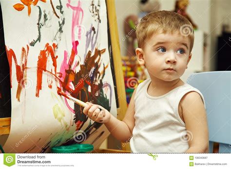 Little Boy Paints A On Easel Stock Image Image Of Talented Wall