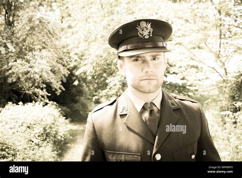 Handsome American Wwii Gi Army Officer In Uniform Walking Through Woods