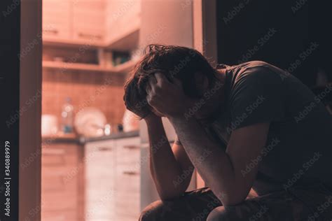 Foto De Depressed Sad Man Crying In Dark Room Do Stock Adobe Stock