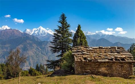 Stone House With Himalaya Mountain Snow Peaks At The Background At