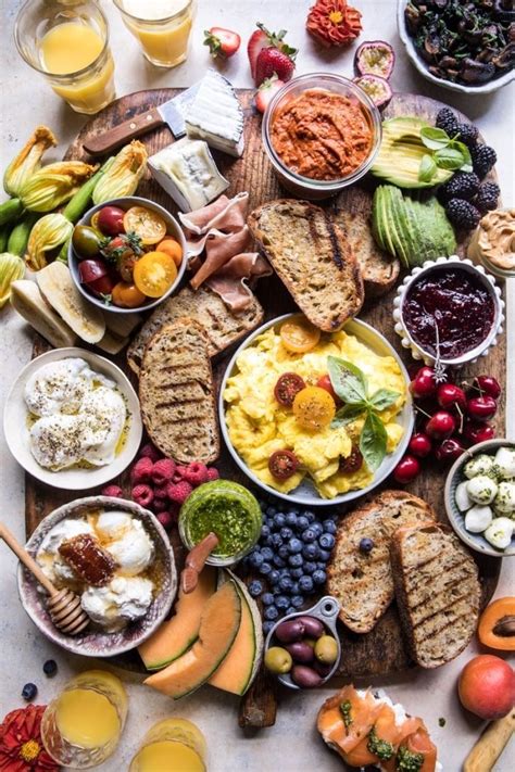 A Table Topped With Lots Of Different Types Of Plates And Bowls Filled