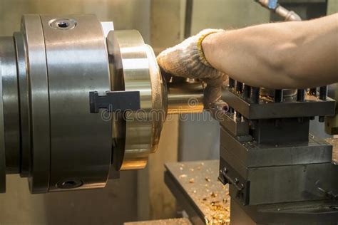 The Machine Operator Working With Brass Material Parts On Lathe Machine
