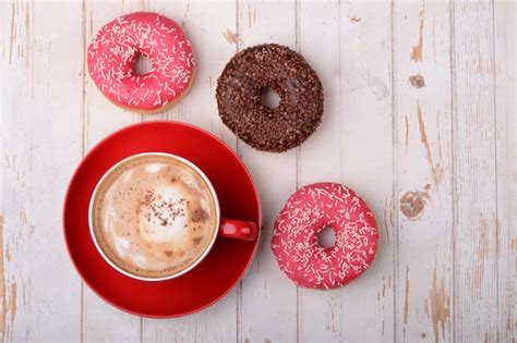 Premium Photo Cup Of Coffee And Donuts