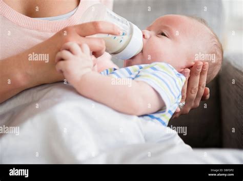 Caucasian Mother Bottle Feeding Baby Stock Photo Alamy