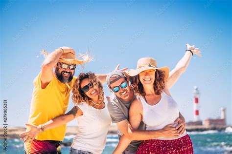 Group Of Happy People And Cheerful Adults Friends Have Fun Together During Summer Holiday