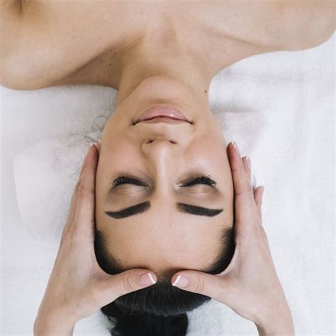 Free Photo Woman Receiving A Relaxing Facial Massage Facial Massage Facial Massage Spa