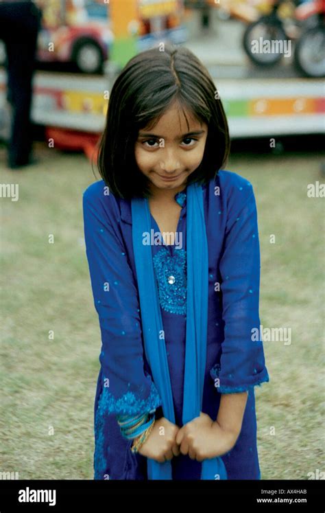 Young Indian Girl At A Fairground During An Indian Mela Festival Held In Barking Park London