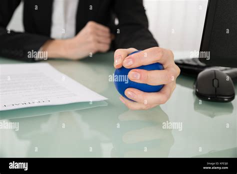 Close Up Of Businesswoman Pressing Stressball In Office Stock Photo Alamy