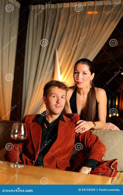 Man Who Sits And Beautiful Girl Standing Next Stock Image Image Of