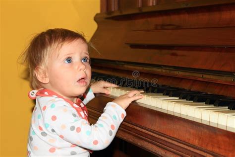 Little Girl Play Yellow Piano Stock Photos Free And Royalty Free Stock