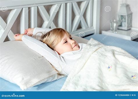 Cute Little Blond Caucasian Girl Awakening At Bed In Morning Child