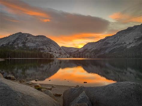 Mountain Lake At Sunset With Rock In Foreground Stock Photo Image Of