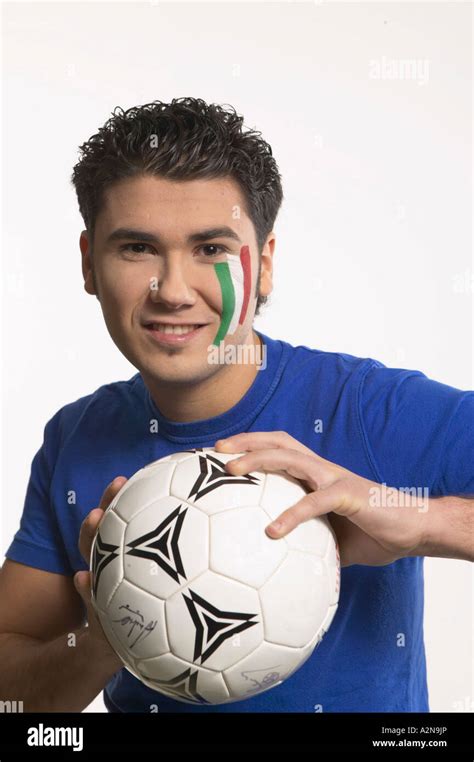 Portrait Of Young Man Holding Soccer Ball And Smiling Stock Photo Alamy