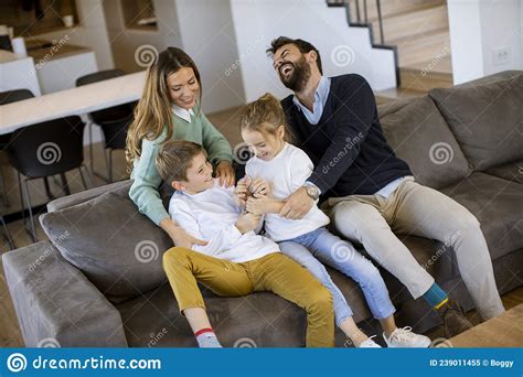 siblings fighting over tv remote control at home stock image image of controller mother