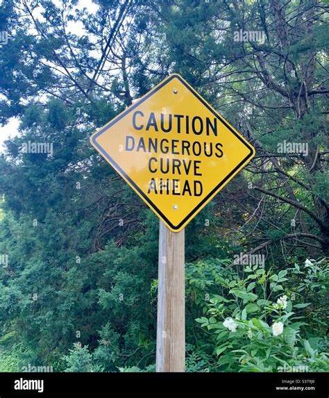 Caution Dangerous Curve Ahead Sign Stock Photo Alamy