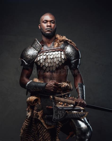 African Barbarian Dressed In Protective Armor And Deerskin Wielding An