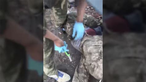 Footage Appears To Show Russian Soldier Castrating Ukrainian Prisoner