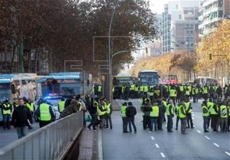 Madrid Police Use Cranes To Clear Road Blocked By Striking Taxi Drivers
