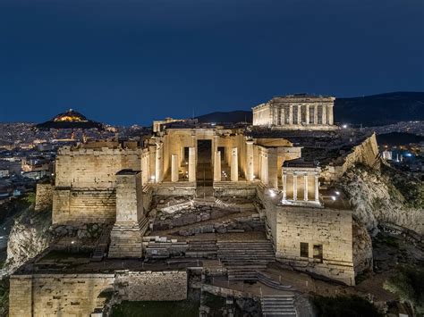 The Acropolis At Night Overlooking The City Of Athens Greece Reurope