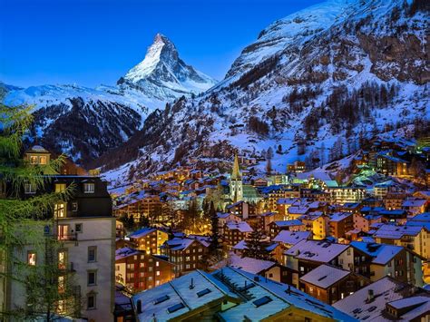 Lighted Matterhorn Village In Swiss Alps On Winter Night