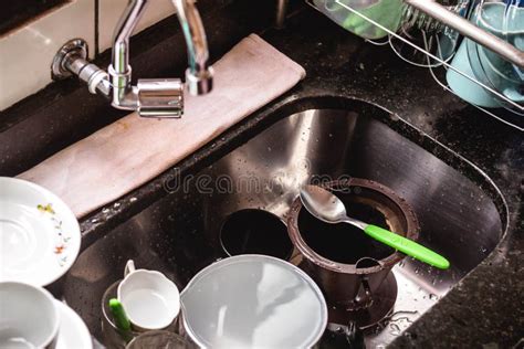 In This Photo Illustration The Sink Tub Full Of Dirty Dishes For