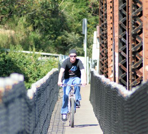 Phil Riding Across The Railroad Trestle Bridge Over The Sa Flickr