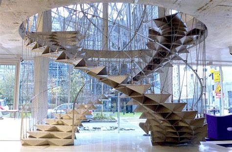 The outer stringers were set in place against the top fastening blocks. ღღ Beautiful!! ~~~ Escalier Origamique (Origami Stairs) in contemporary furniture store Nantes ...