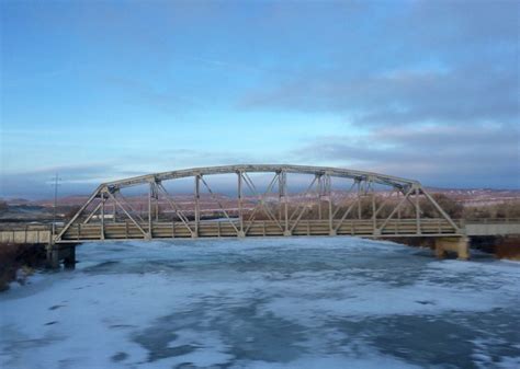 A Frozen Lake Underneath A Bridge Some Place In Colorado Nature