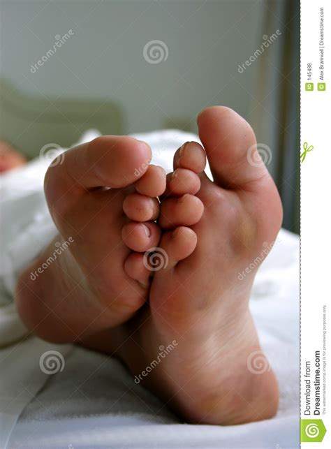 If you can just wait a second and hear me out emily, everything will be okay. Feet In Bed Royalty Free Stock Photos - Image: 145488