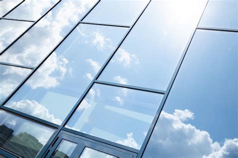 Glass Building Facade With Blue Sky Reflection Photo Premium Download