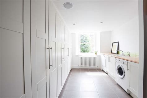 'low shelves and clothes pegs small fingers can manage make this a space where it's easy for a child to join in with the laundry,' says kristina. Ikea Pax Planner for a Contemporary Laundry Room with a ...