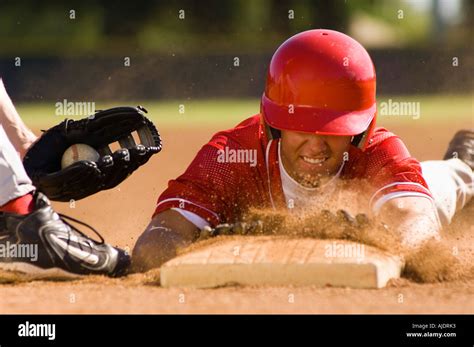 Baseball Player Sliding Into Base Stock Photo Alamy