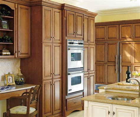 The lighter maple cabinets are used in a majority of the space and help give it a warmth and comfortable feel. Coriander Coffee Glazed Cabinet Finish on Maple - Decora