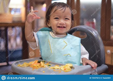 Cute Happy Smiling Asian Toddler Baby Girl Eating By Hands Little Kid